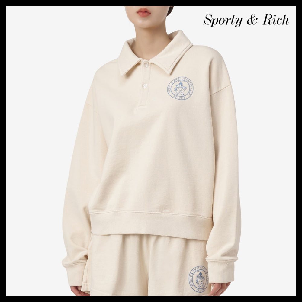 【SPORTY & RICH】ライオンクレストポロシャツ